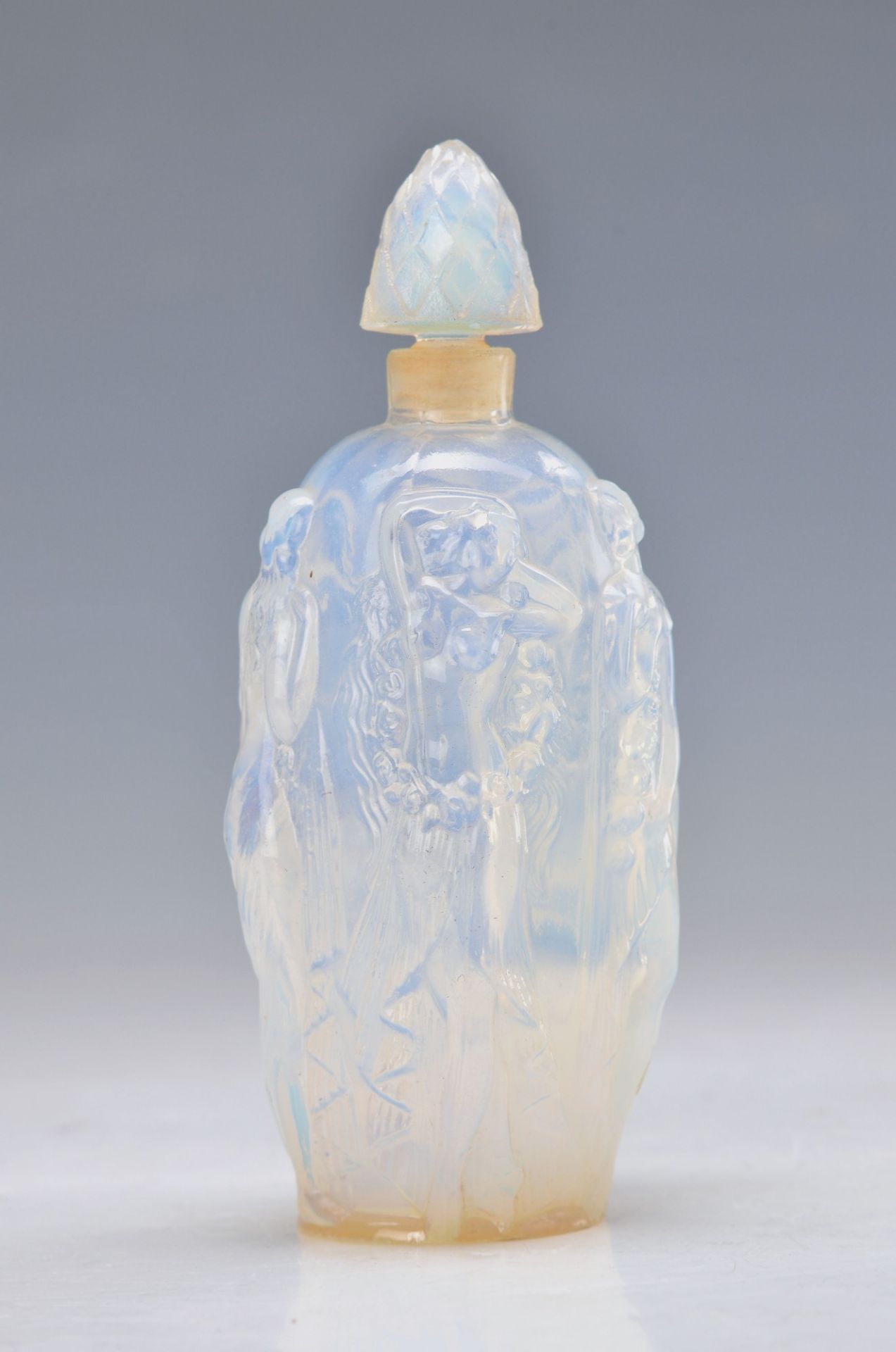 perfume bottle, France, around 1930, so-called Opaline glass, blown into the mold, five encircling