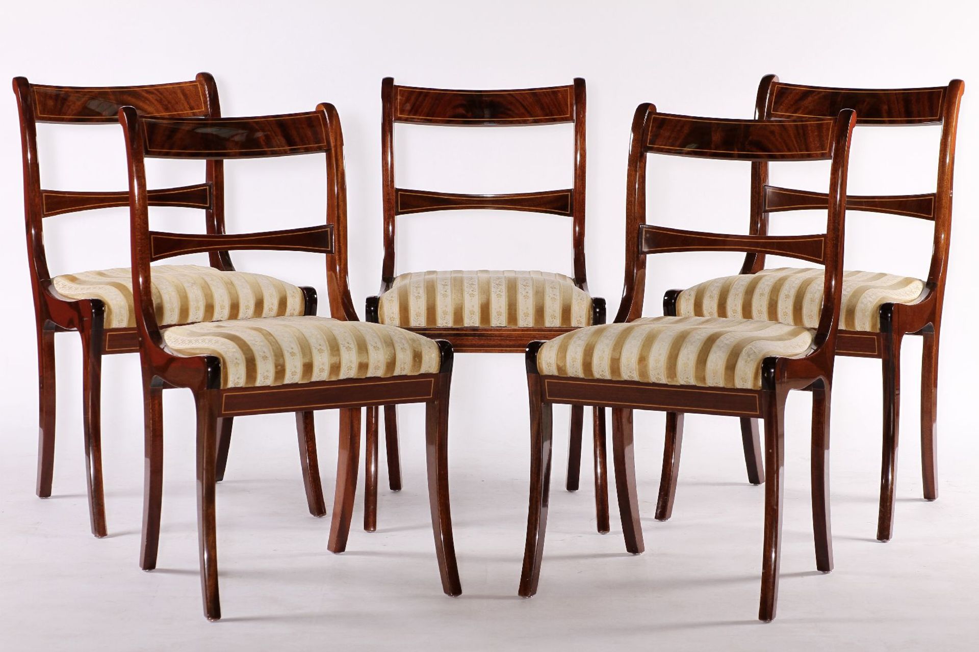 5 chairs, partly solid Mahogany and veneer, elegantly curved, ocher and cream-colored striped fabric