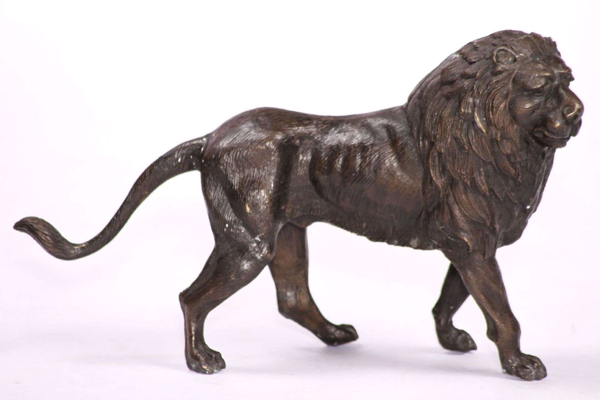 Lion, bronze, idealistic representation, dark brown or anthracite, oriented to the right, good heavy