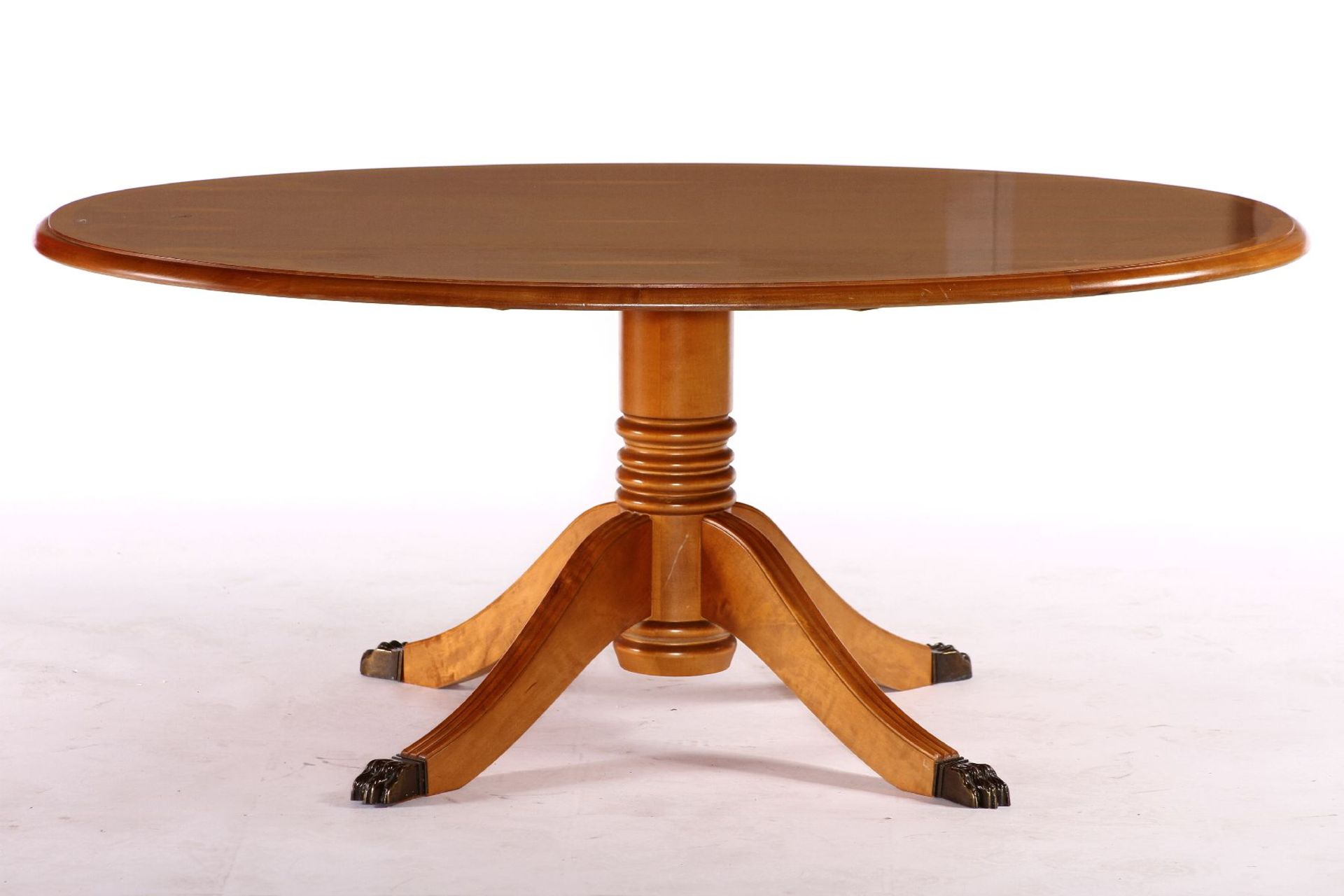 Oval coffee table, solid wood, top probably yew veneer, round column shaft, 4 slightly curved