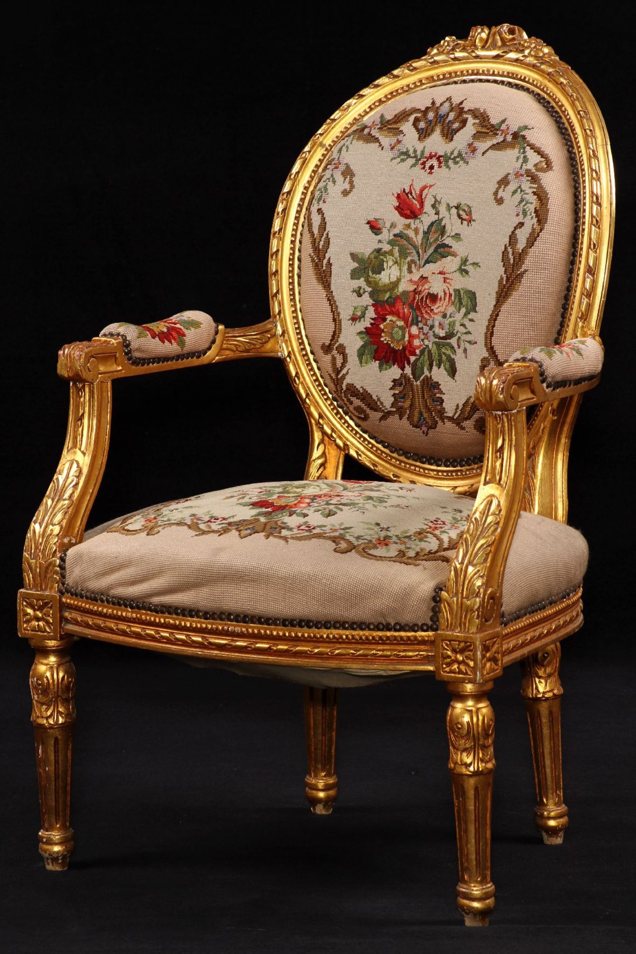 Armchair, frame in solid wood, painted gold, rich ornamental carvings in the form of roses,