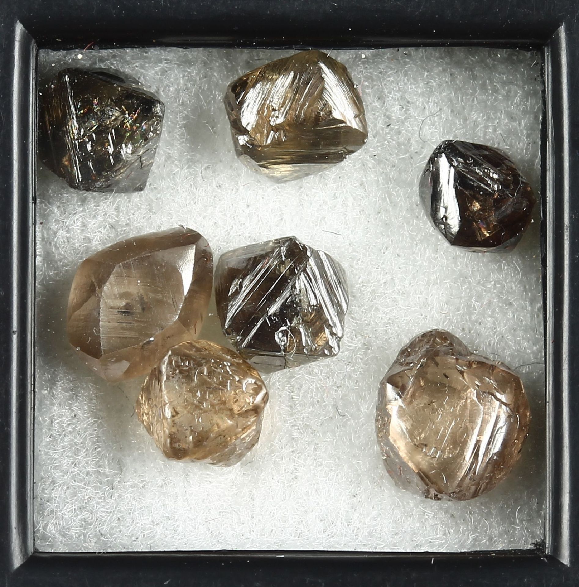 Lot 7 loose octahedron rough diamonds , total approx. 9.25 ct, in different sizes and colours