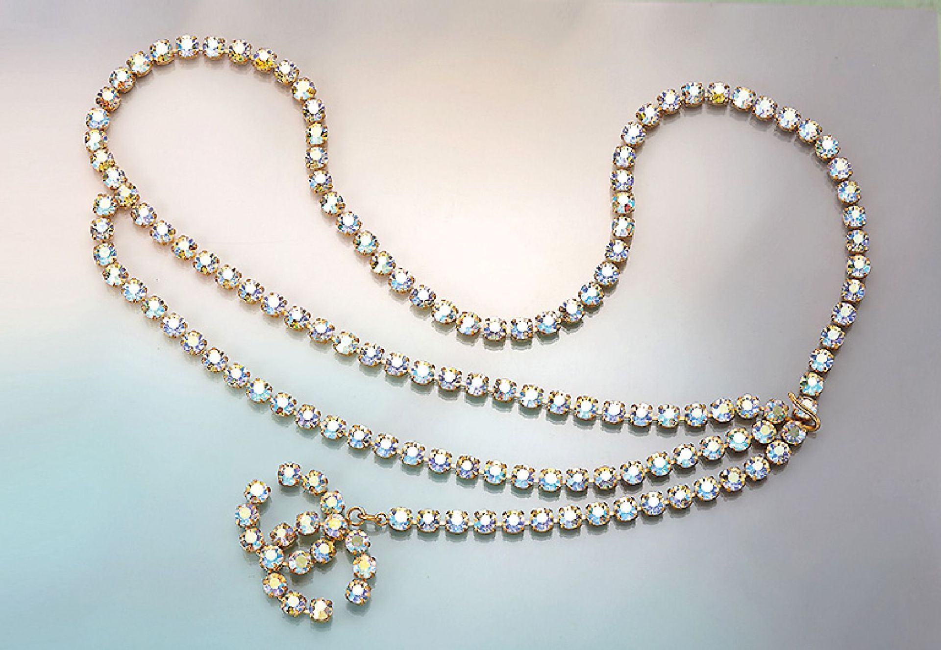 Extra-long CHANEL chain with rhine stones , Made in France, metal gilt, with bevelled rhine