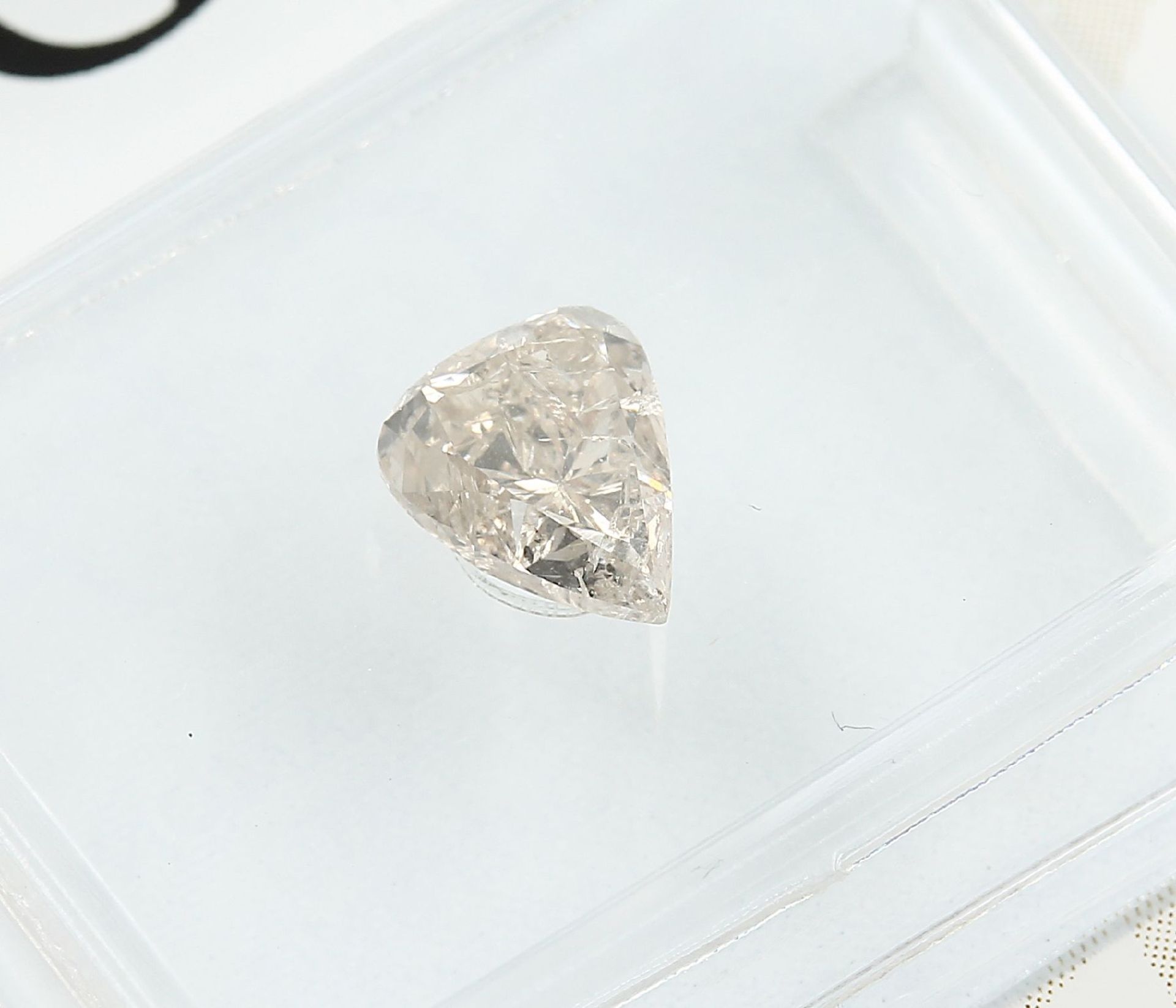 Sealed diamond-pear 0.70 ct, Natural, Fancy Light Yellow-Brown, GIA expertise Valuation Price: 1610, - Bild 2 aus 4