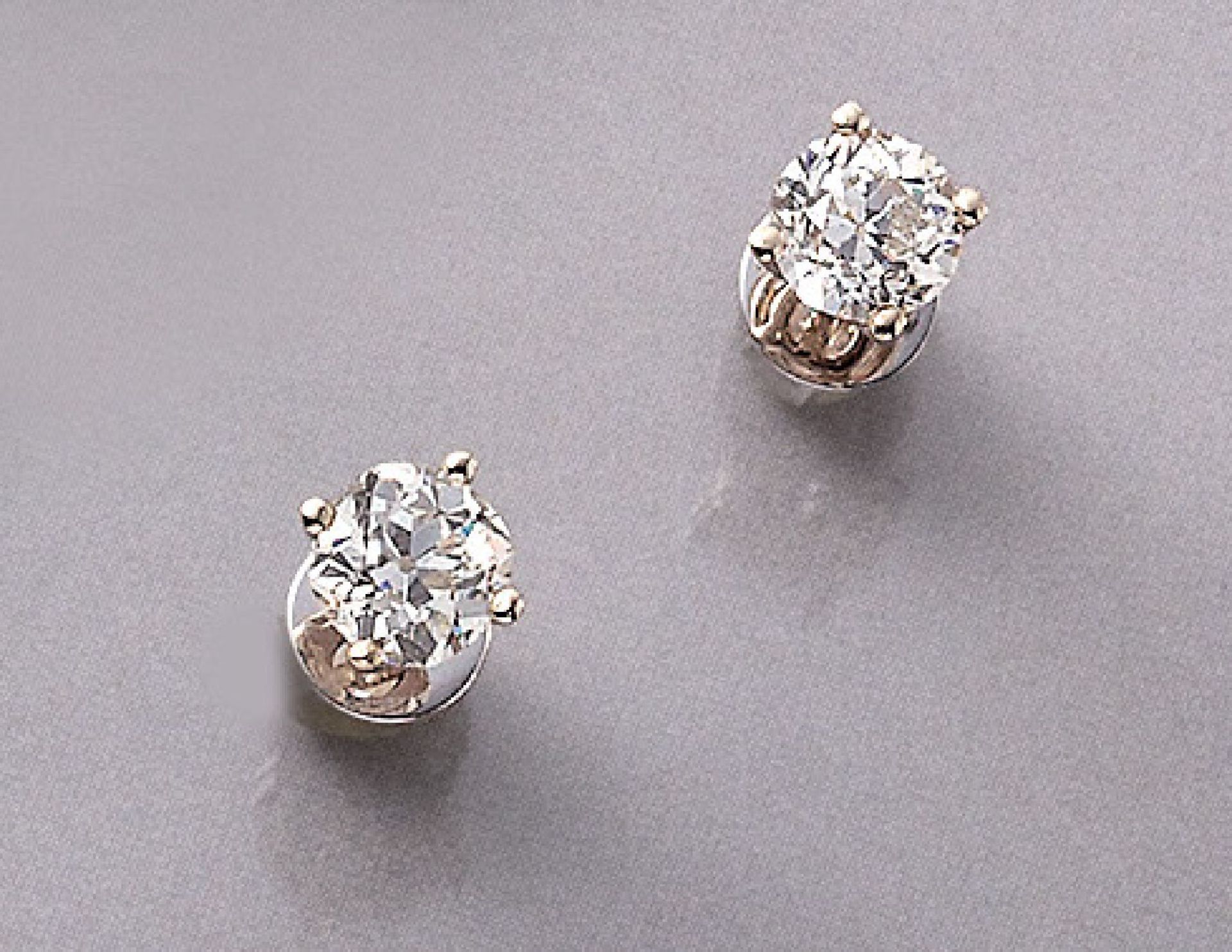 Pair of 14 kt gold earrings with diamonds , WG 585/000, each 1 old cut diamond total approx. 2.02 ct