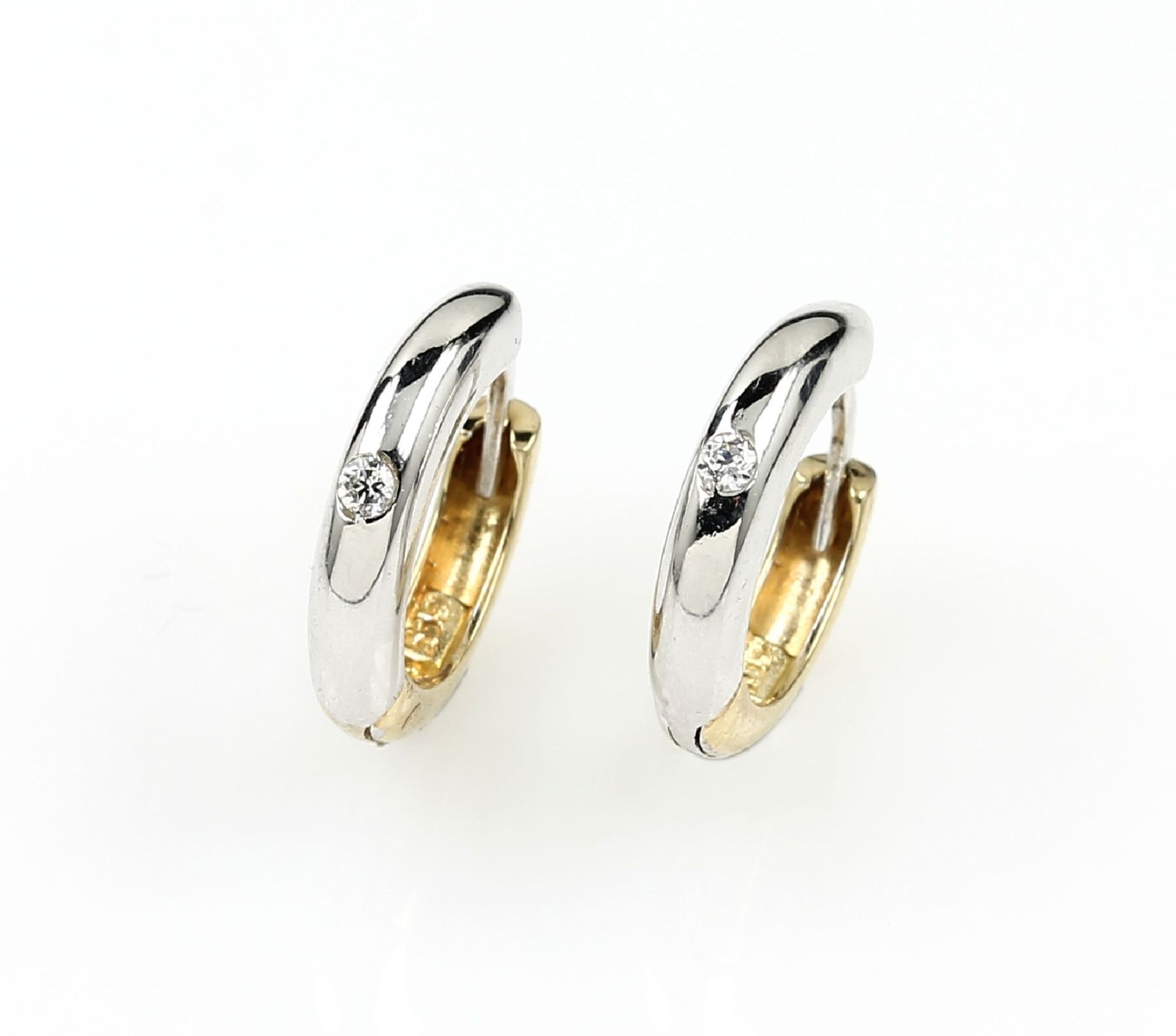 Pair of 14 kt gold hoop earrings with brilliants , YG/ WG 585/000, brilliants total approx. 0.06