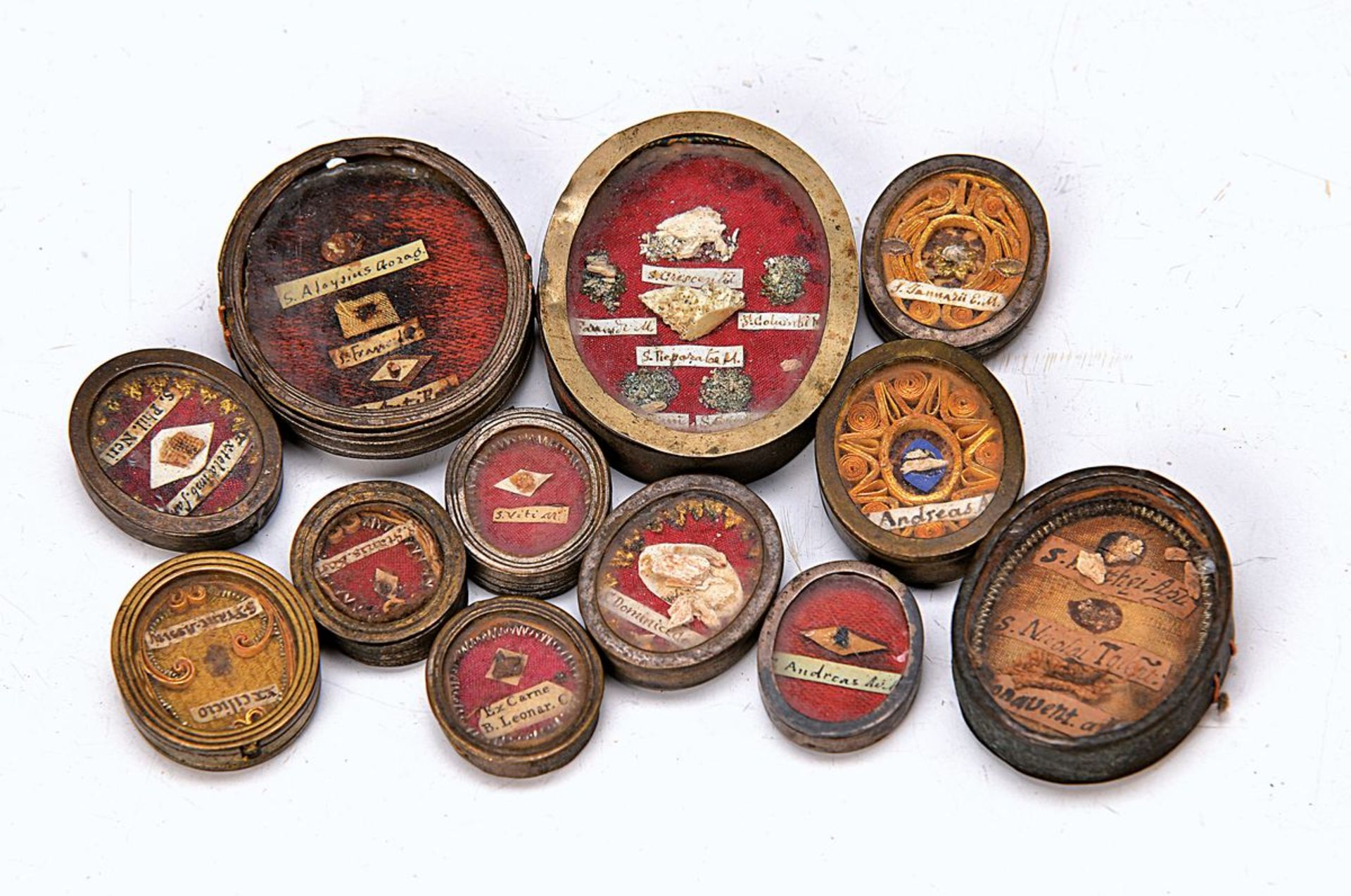 12 relics, Southern Germany, 19th c., all hand lettered, H. 2.4 -6 cm minor damages of age12