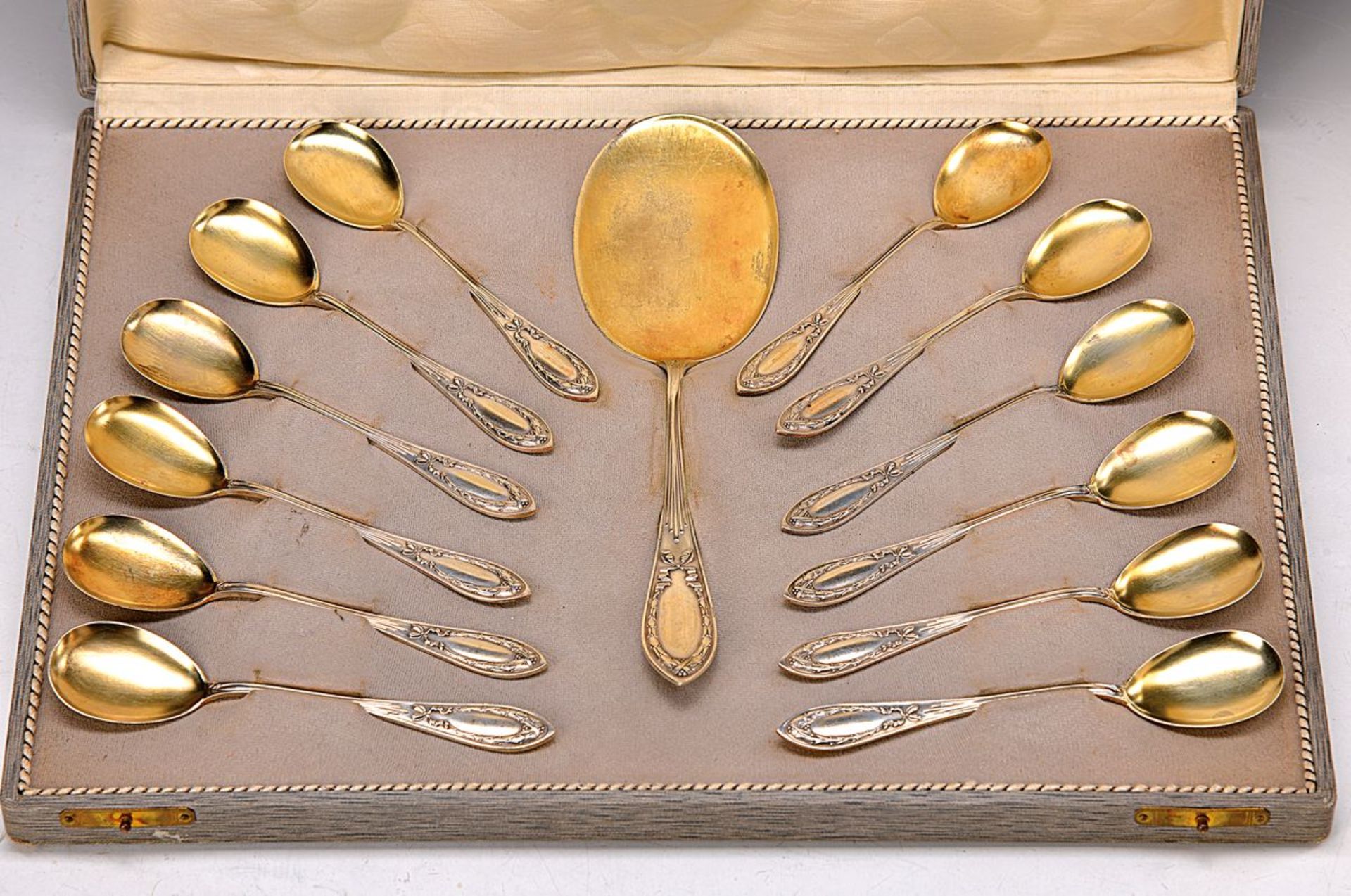 Ice-/dessert cutlery, Auerhahn, around 1900/10, using parts gilt, 12 spoons and one serving part, in