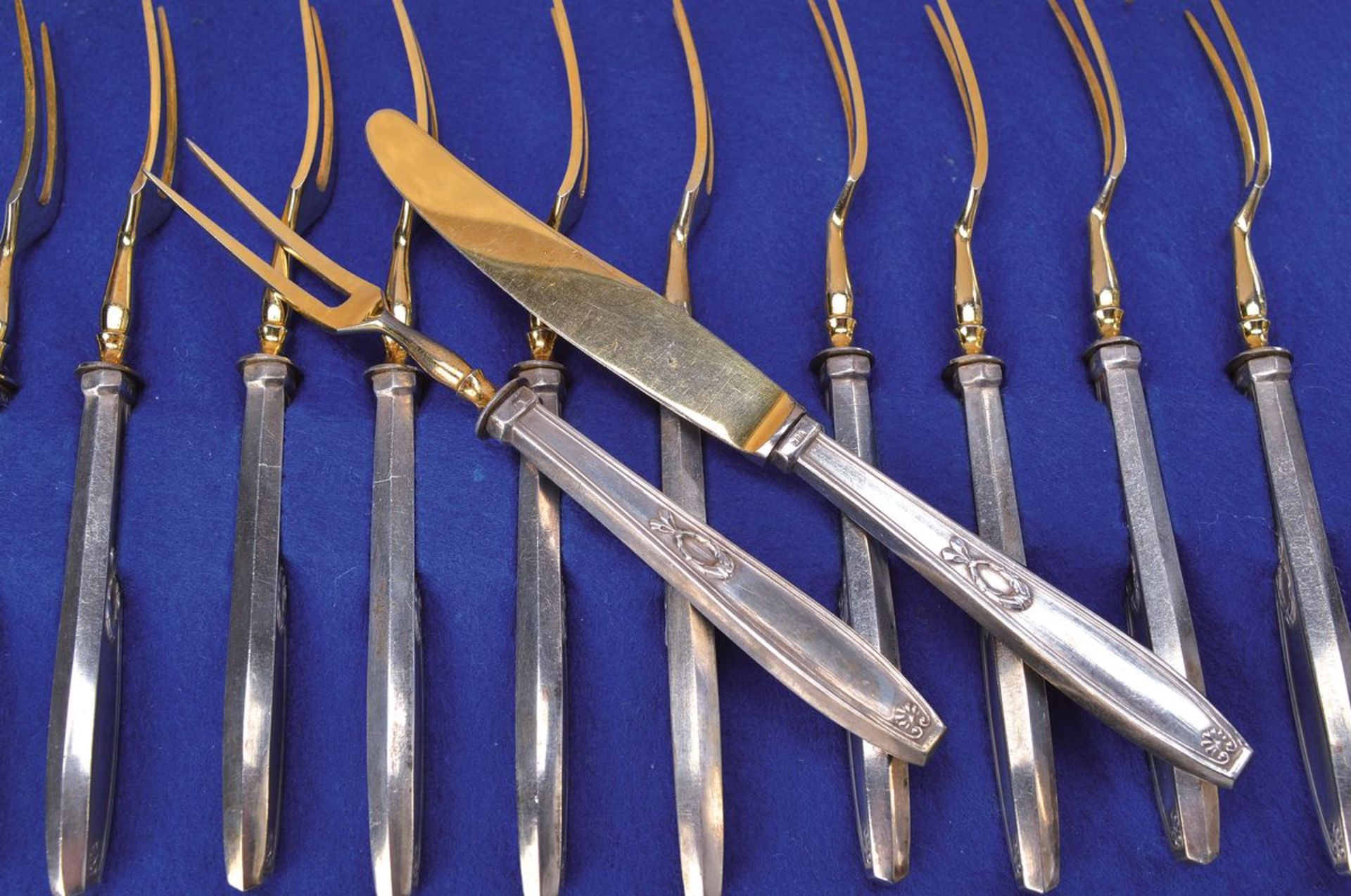 Fruit cutlery, German, around 1900, 800 silver, 11 forks, 12 knives, using parts gilt,L. approx.,