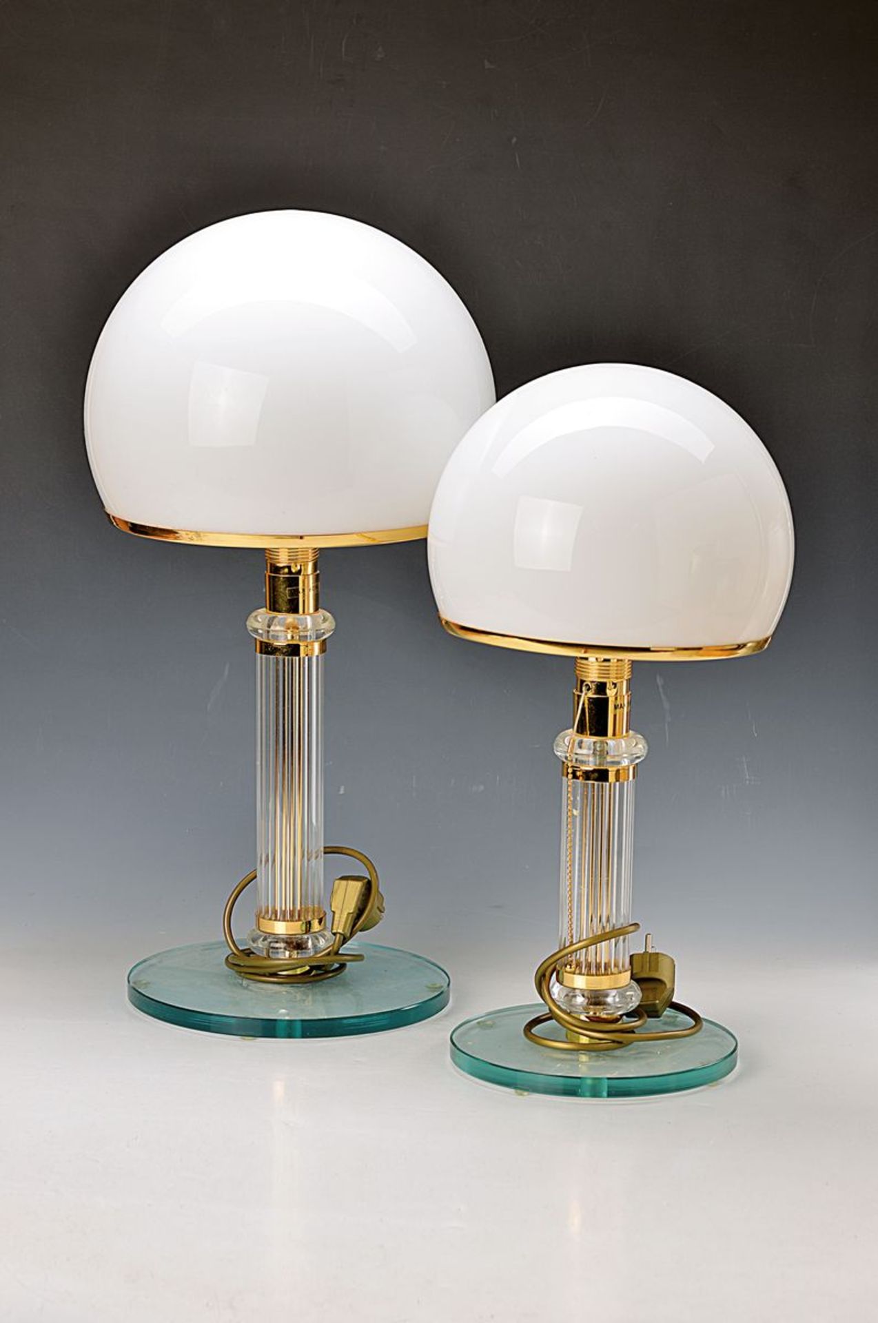 pair of table lamps, France, after ancient model, optical blown glass stem, brass fittings,