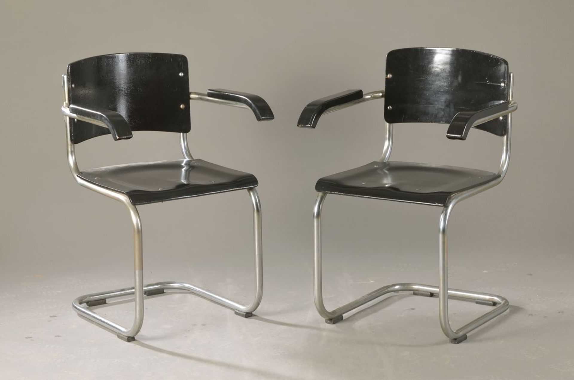 2 armchairs, Marcel Breuer and Mart Stam, 1930s, steel, bentwood black lacquered, seat pillow with