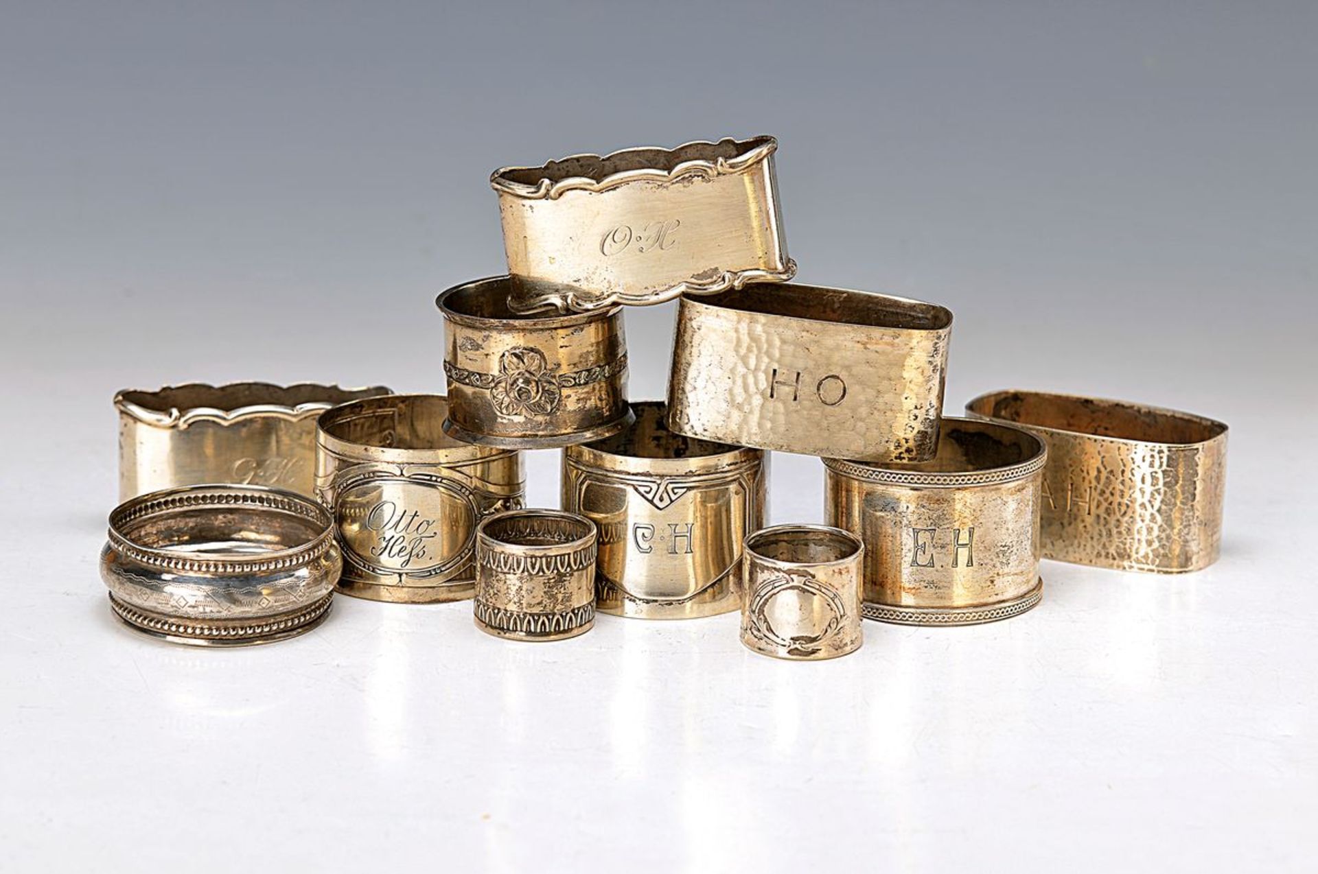 11 napkin rings, German, around 1900/20, mostly 800 or 835 silver, partly monogramm, approx. 70 g,