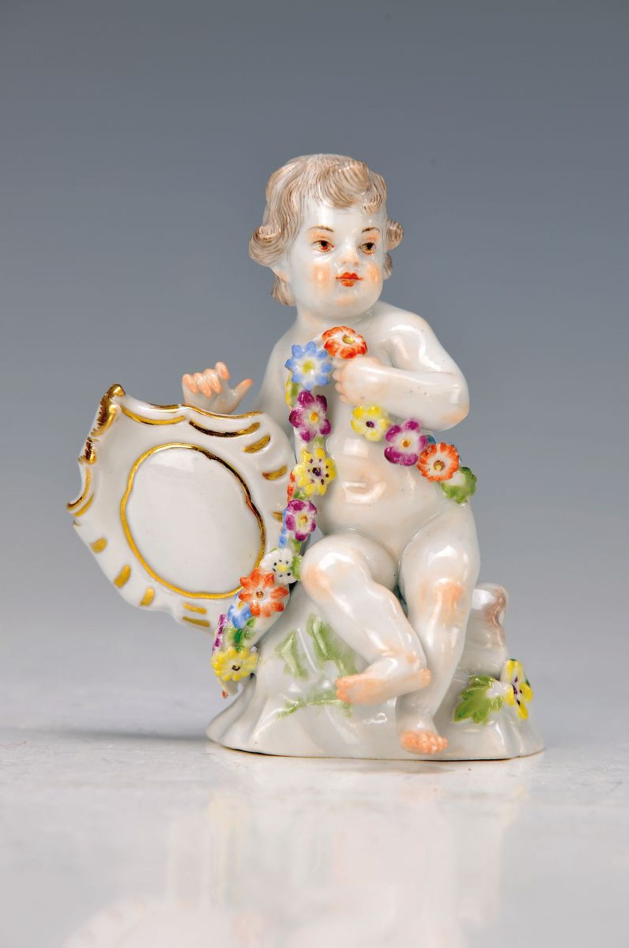 figurine, Meissen, 1924-33, Model no. 1747, cupid with garland and buckler, polychrome painted, gold