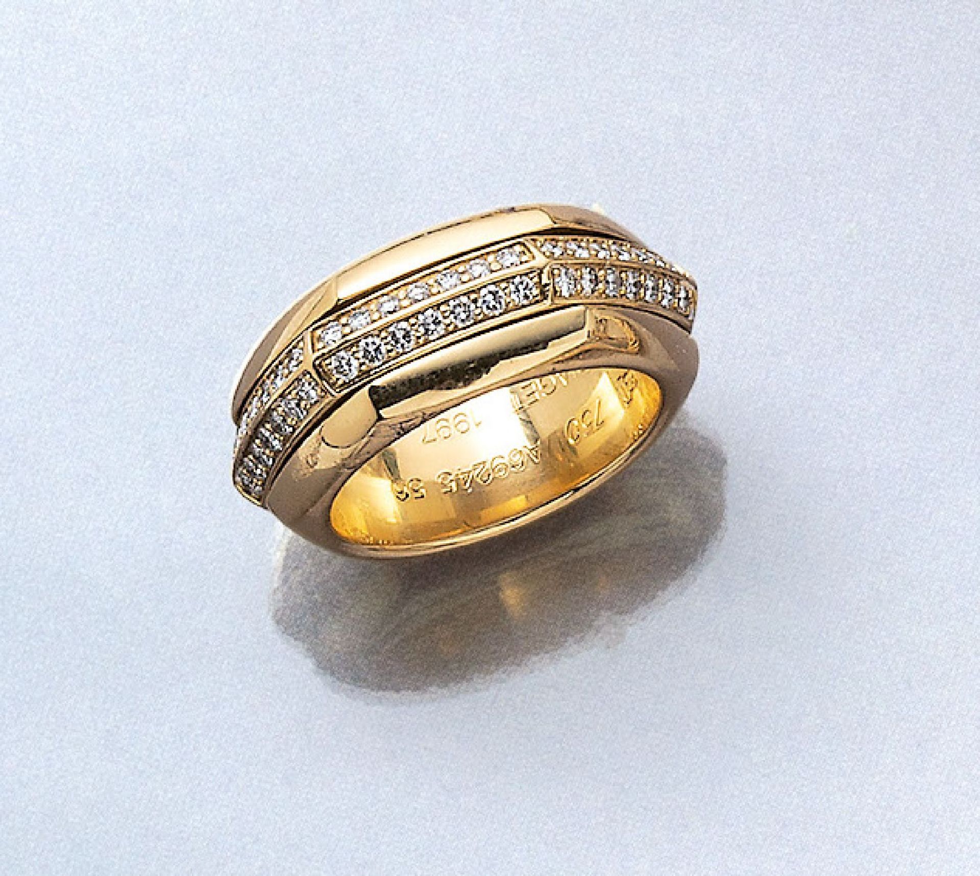 18 kt Gold PIAGET Ring mit Brillanten, GG 750/000, Mittelschiene drehbar, 2-rhg. bes. mit Brillanten