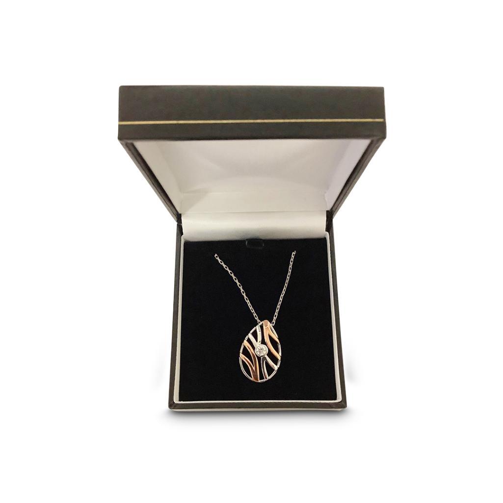 A ROSE GOLD GEM SET PENDANT ON CHAIN