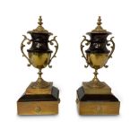 PAIR OF BLACK MARBLE AND BRASS URNS