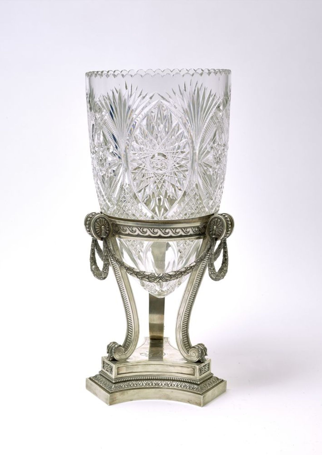 An important Faberge silver-mounted cut crystal vase in Neoclassical style. The [...]