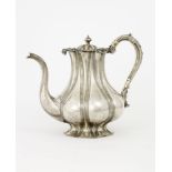 SILVER-GILT LOBED TEAPOT AND SUGAR BOWL ADORNED WITH EMBOSSED FLORAL DÉCOR, Assay [...]