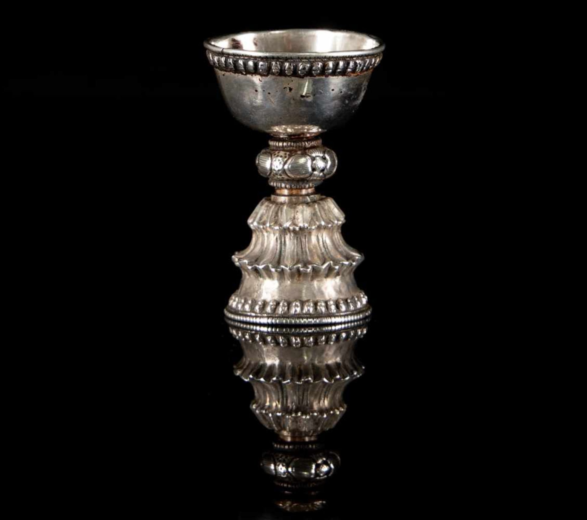 A Tibetan silver butter lamp