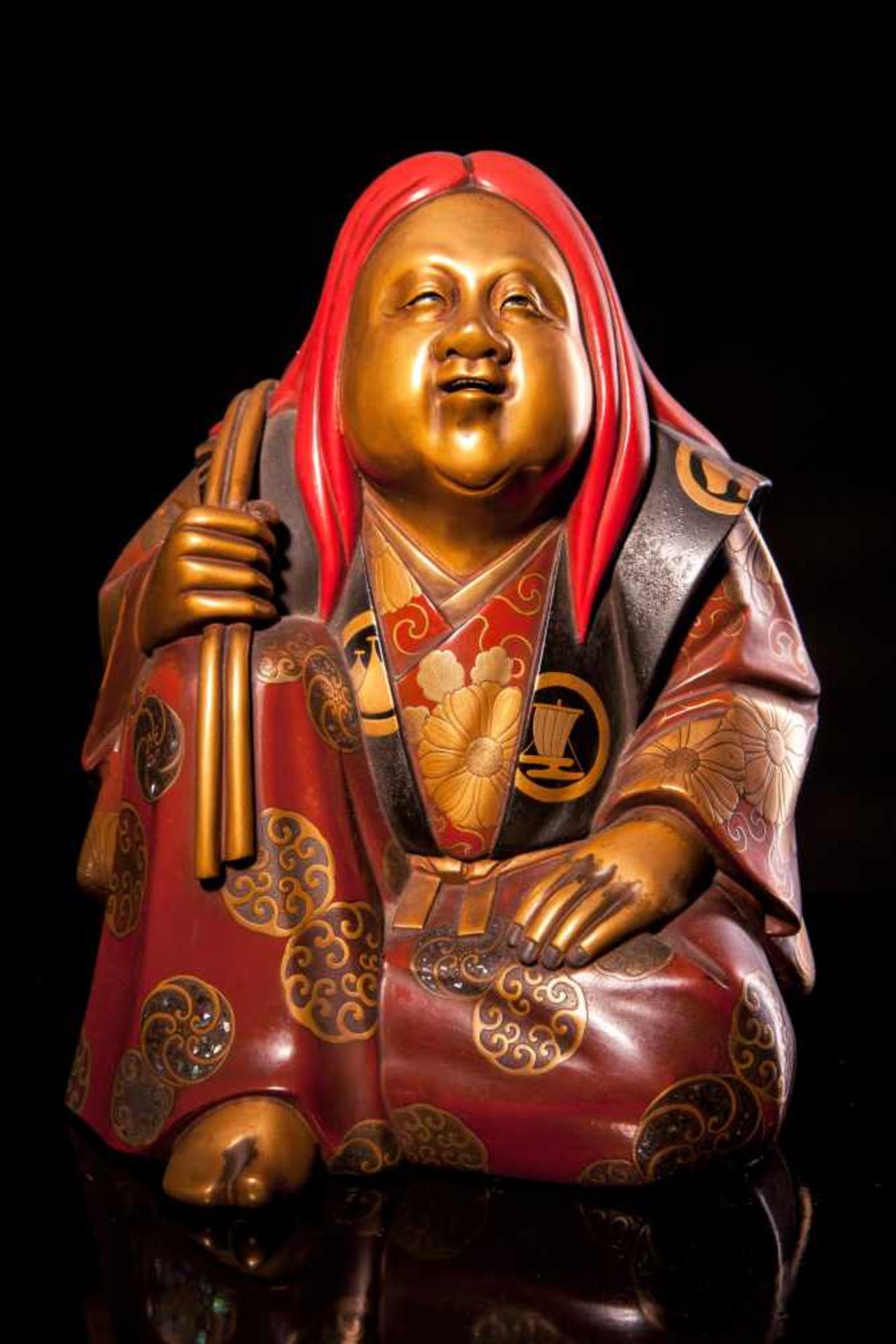 A Japanese Gilt Lacquered figure of Otafuku