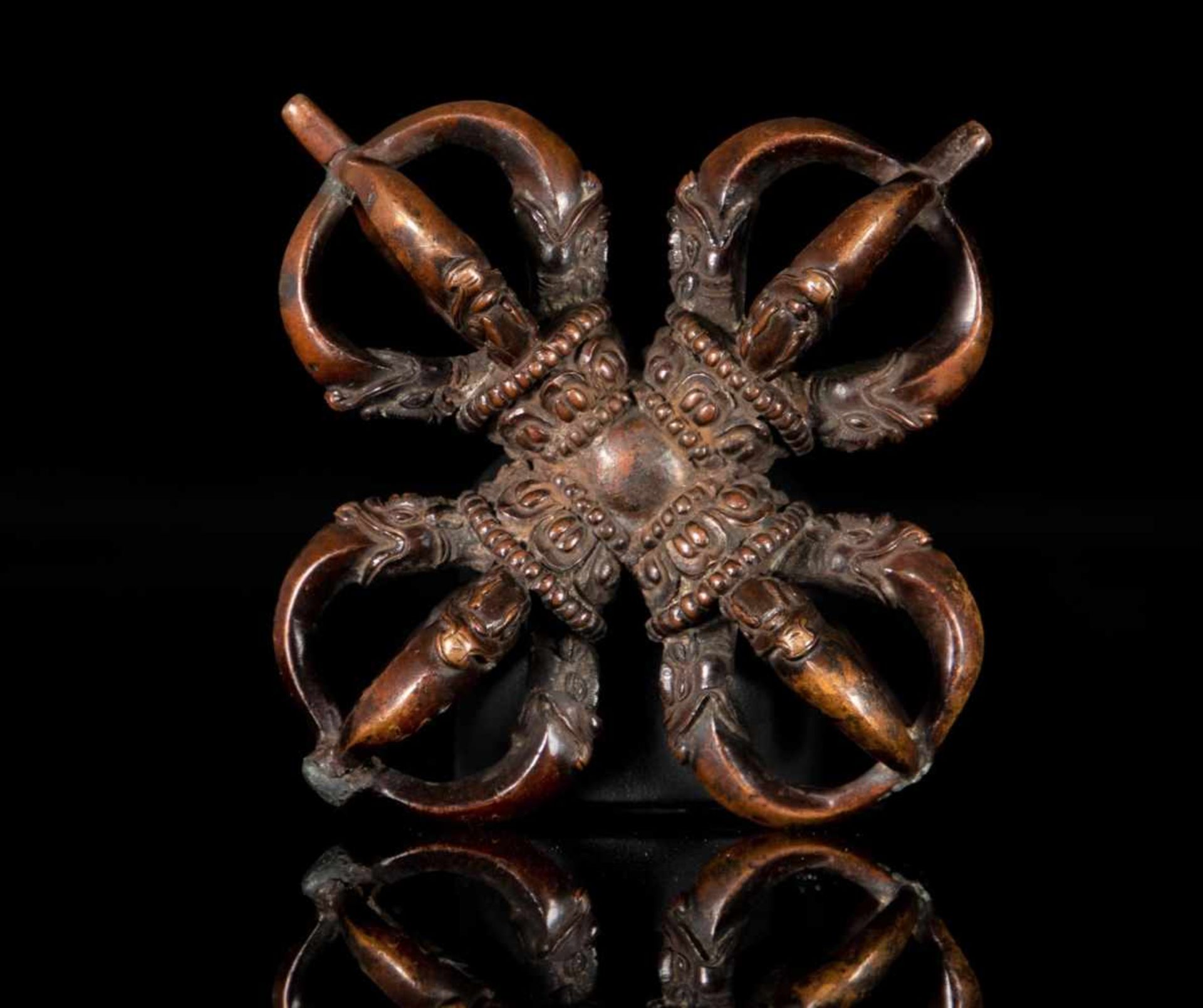 A rare bronze double vajra or dorje