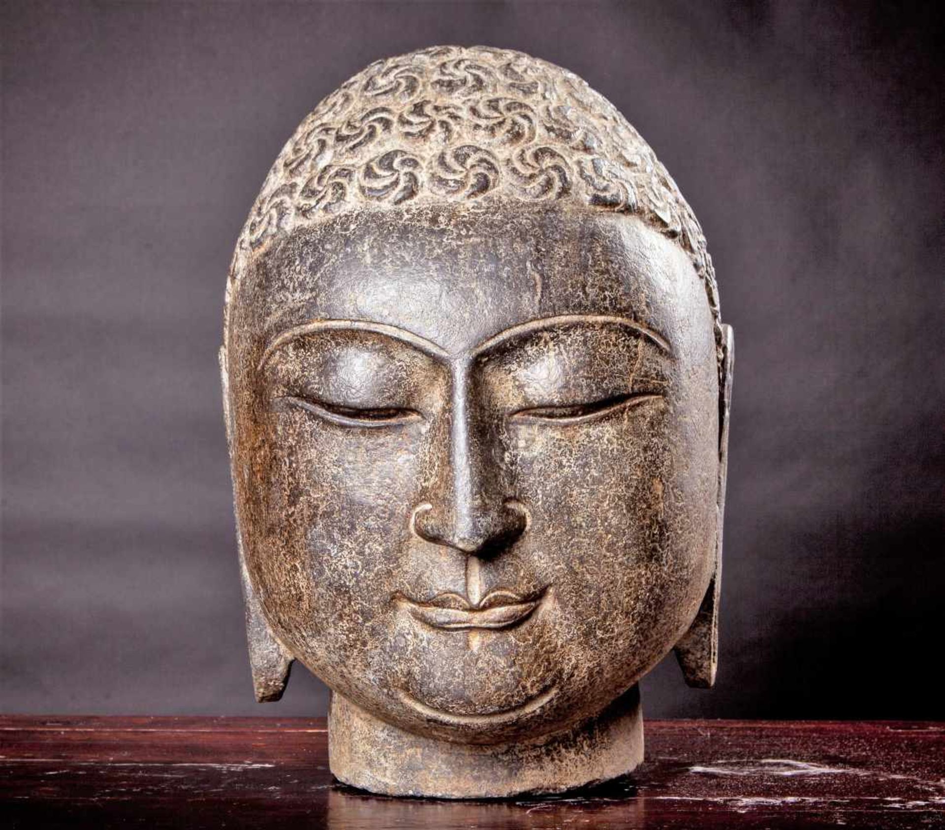 A Chinese Carved Stone Head of Buddha