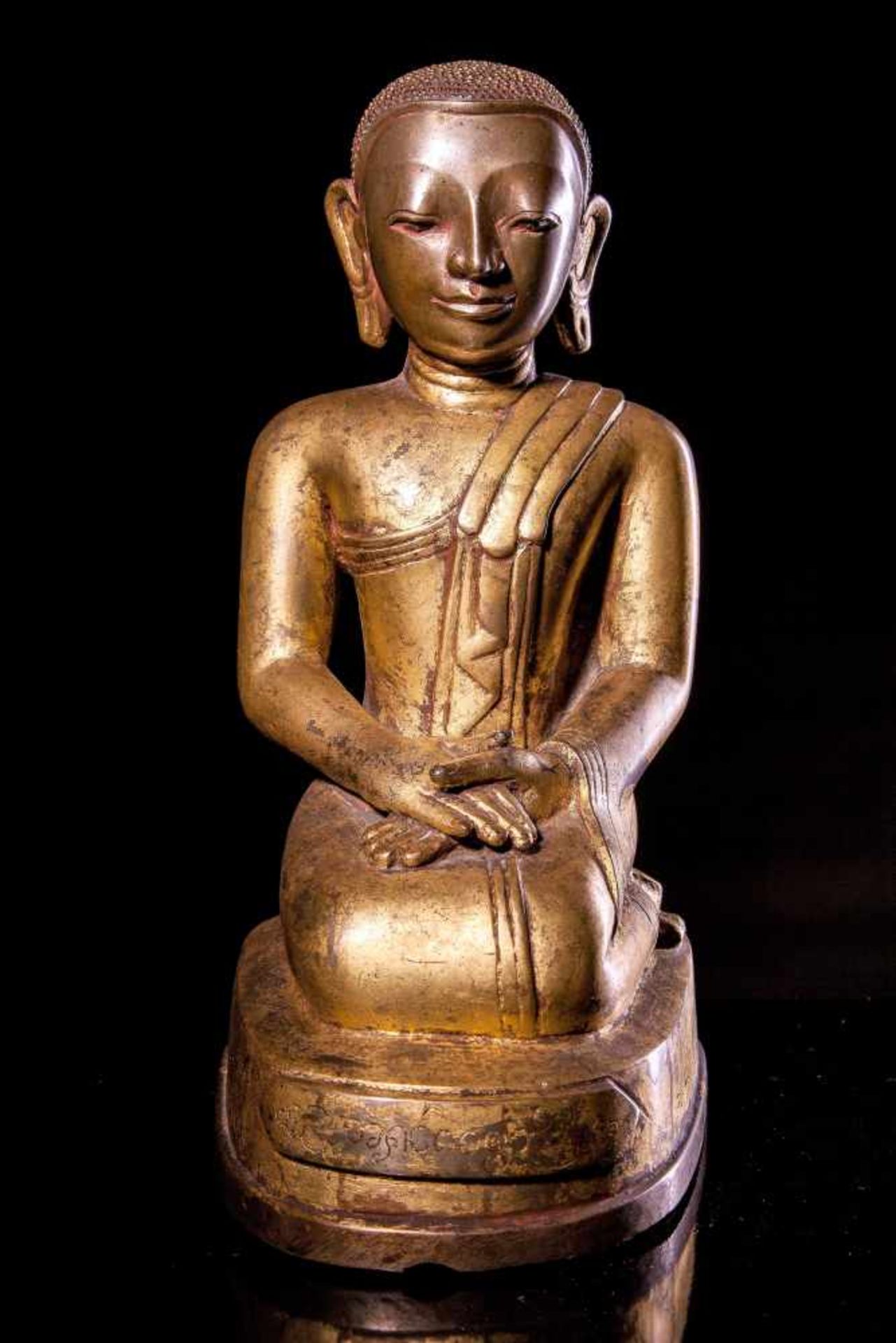 A Bronze Figure of a Kneeling Monk