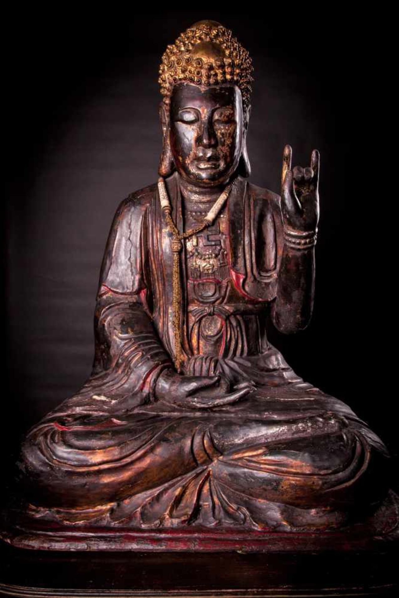 A Massive Gilt and Lacquered Wood Buddha