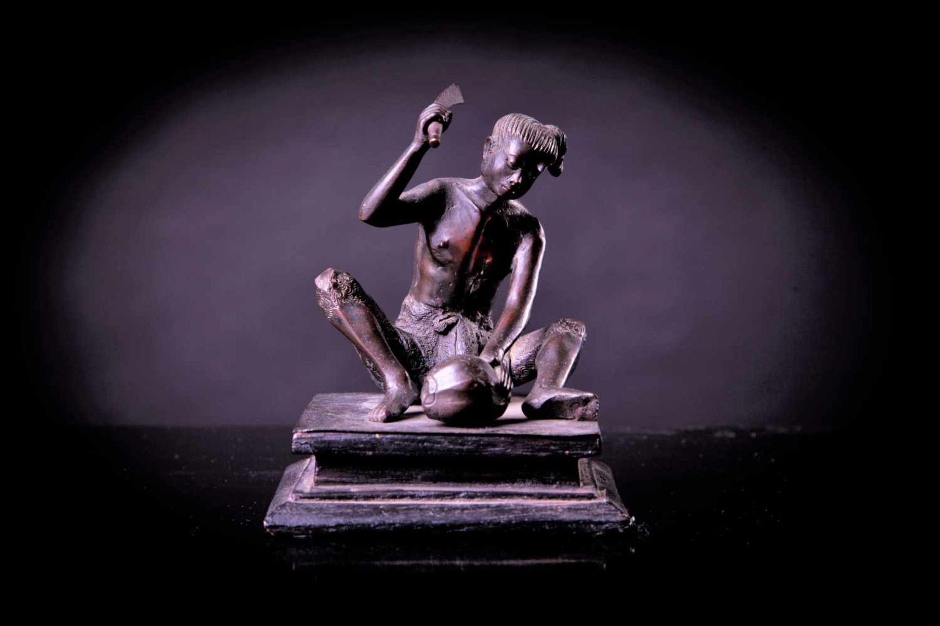 A Bronze Figure of a Young Man