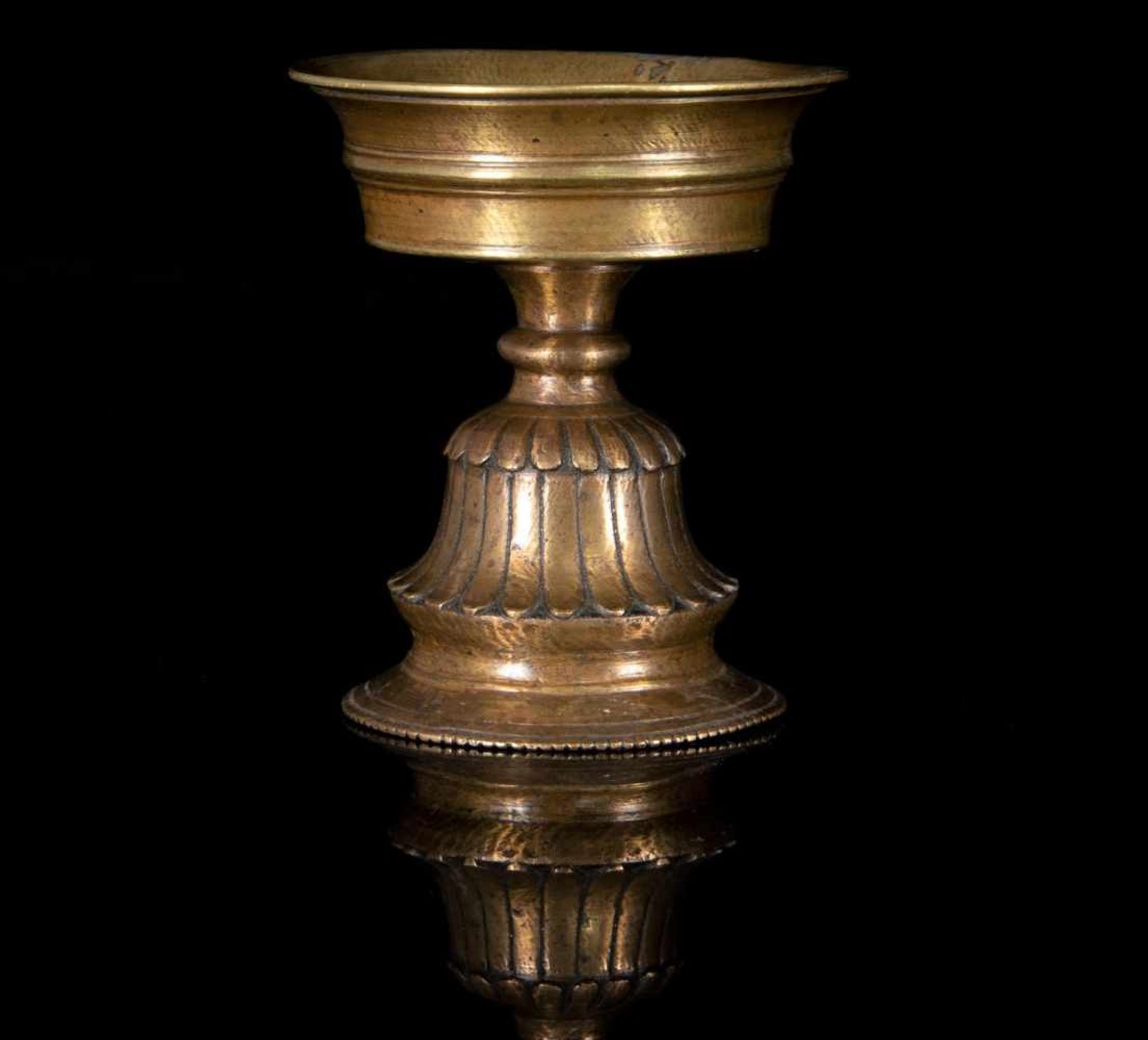 A bronze butter lamp