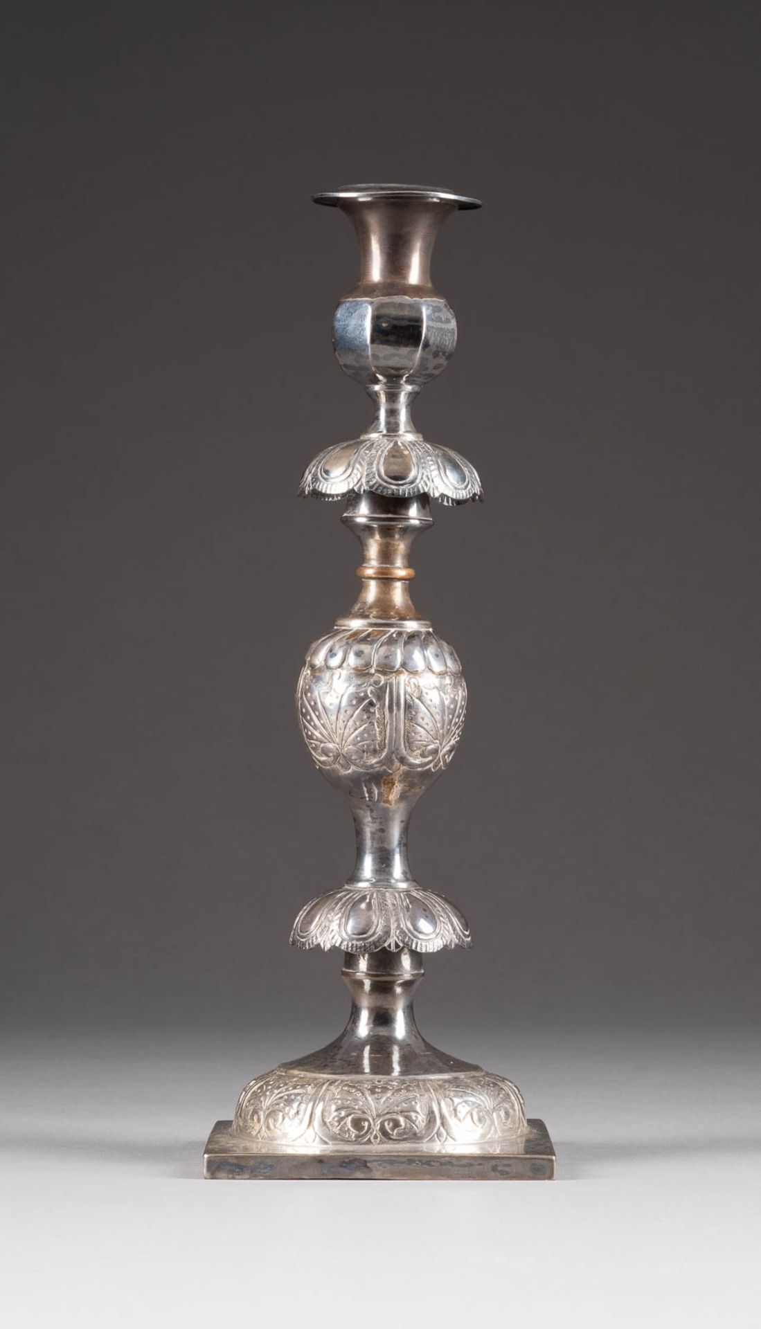 A SILVER CANDLE STICK HOLDER