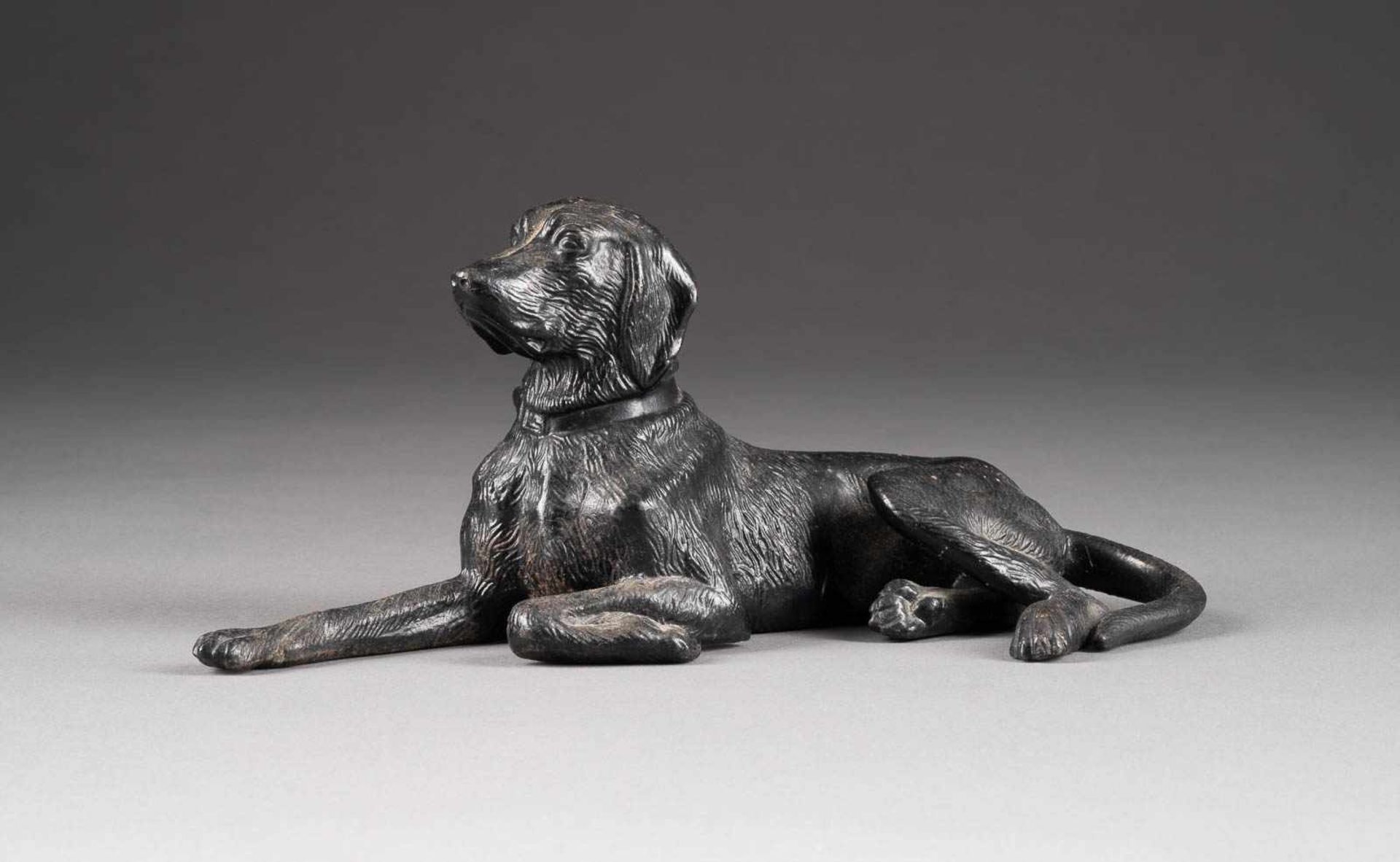 AN IRON FIGURE OF A DOG