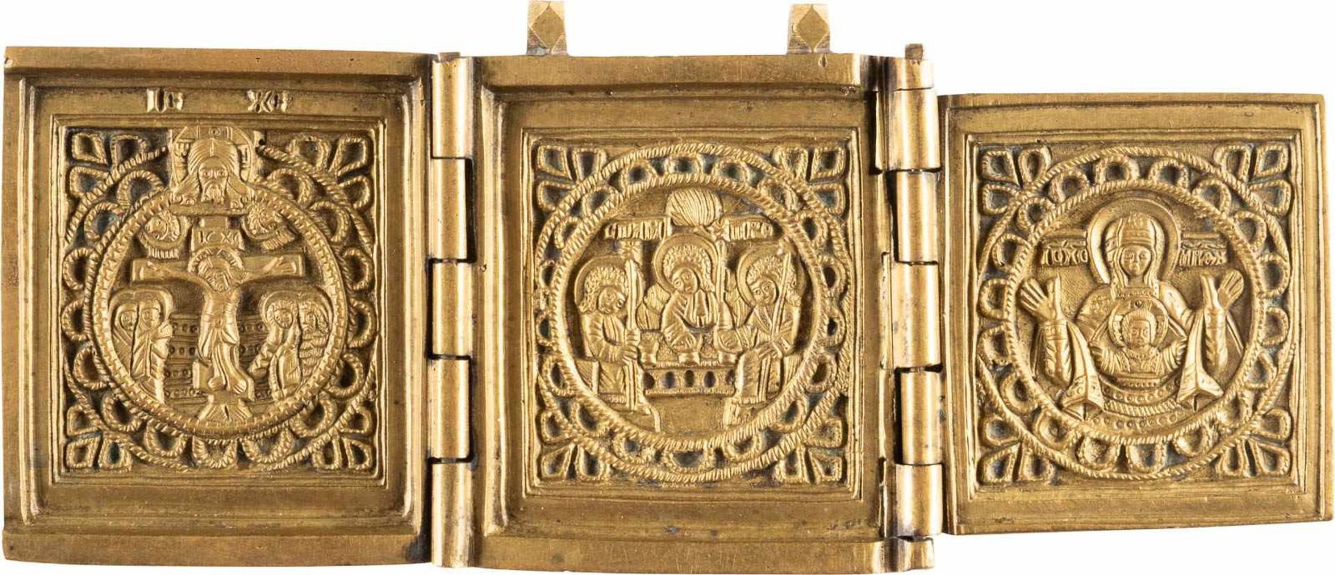 A RARE BRASS TRIPTYCH SHOWING THE CRUCIFIXION, THE OLD TESTAMENT TRINITY AND THE MOTHER OF
