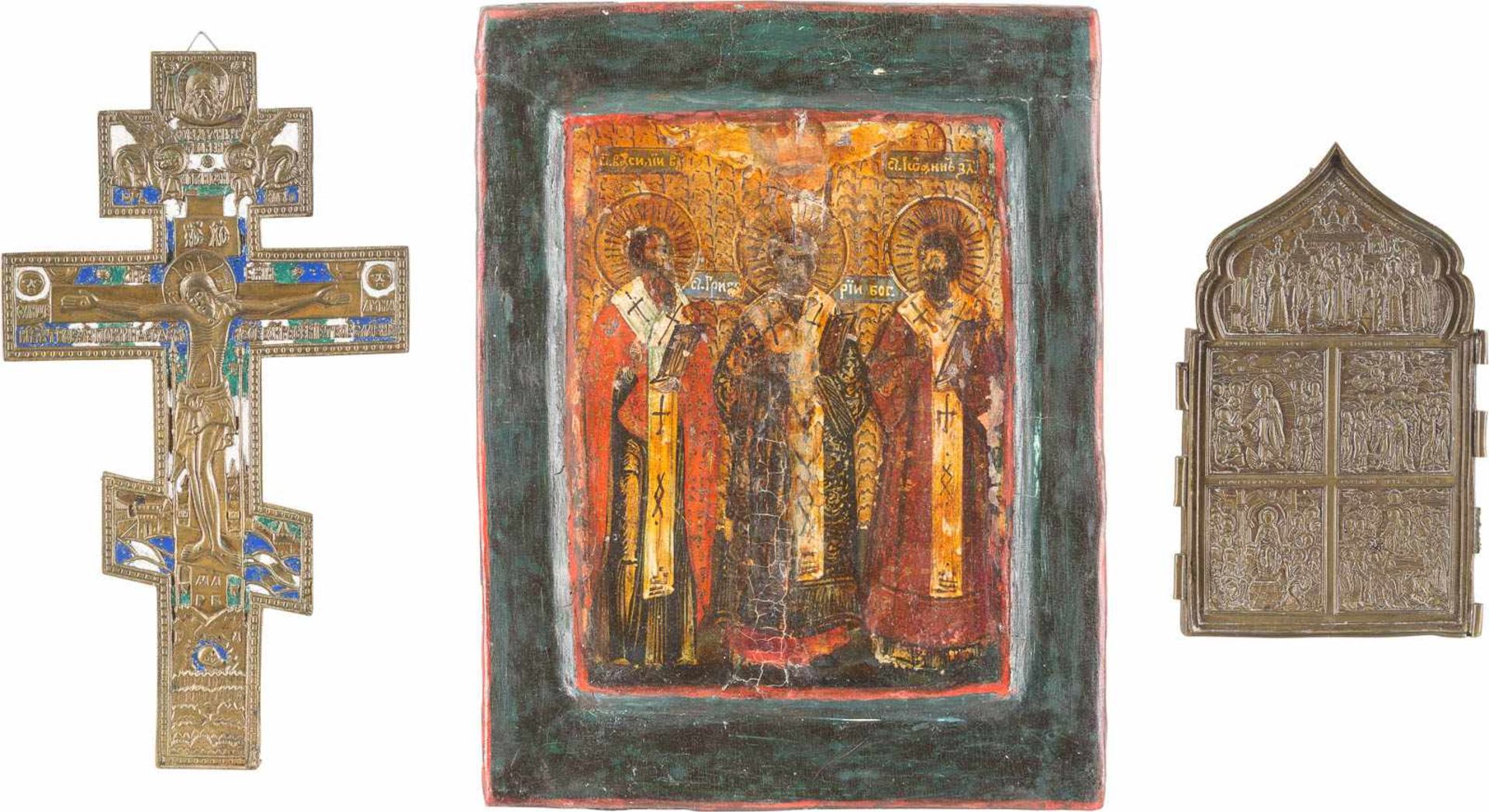 A SMALL ICON SHOWING THE THREE HIERARCHS OF ORTHODOXY, A BRASS CRUCIFIX AND A BRASS