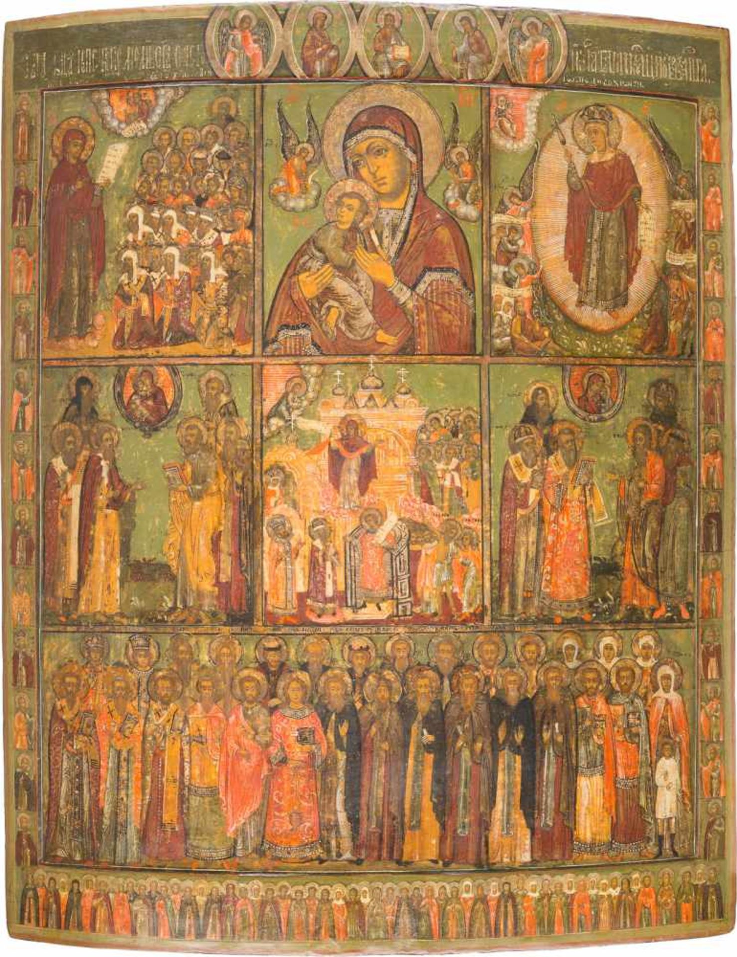 A MONUMENTAL MULTI-PARTITE ICON SHOWING IMAGES OF THE MOTHER OF GOD AND SELECTED SAINTS