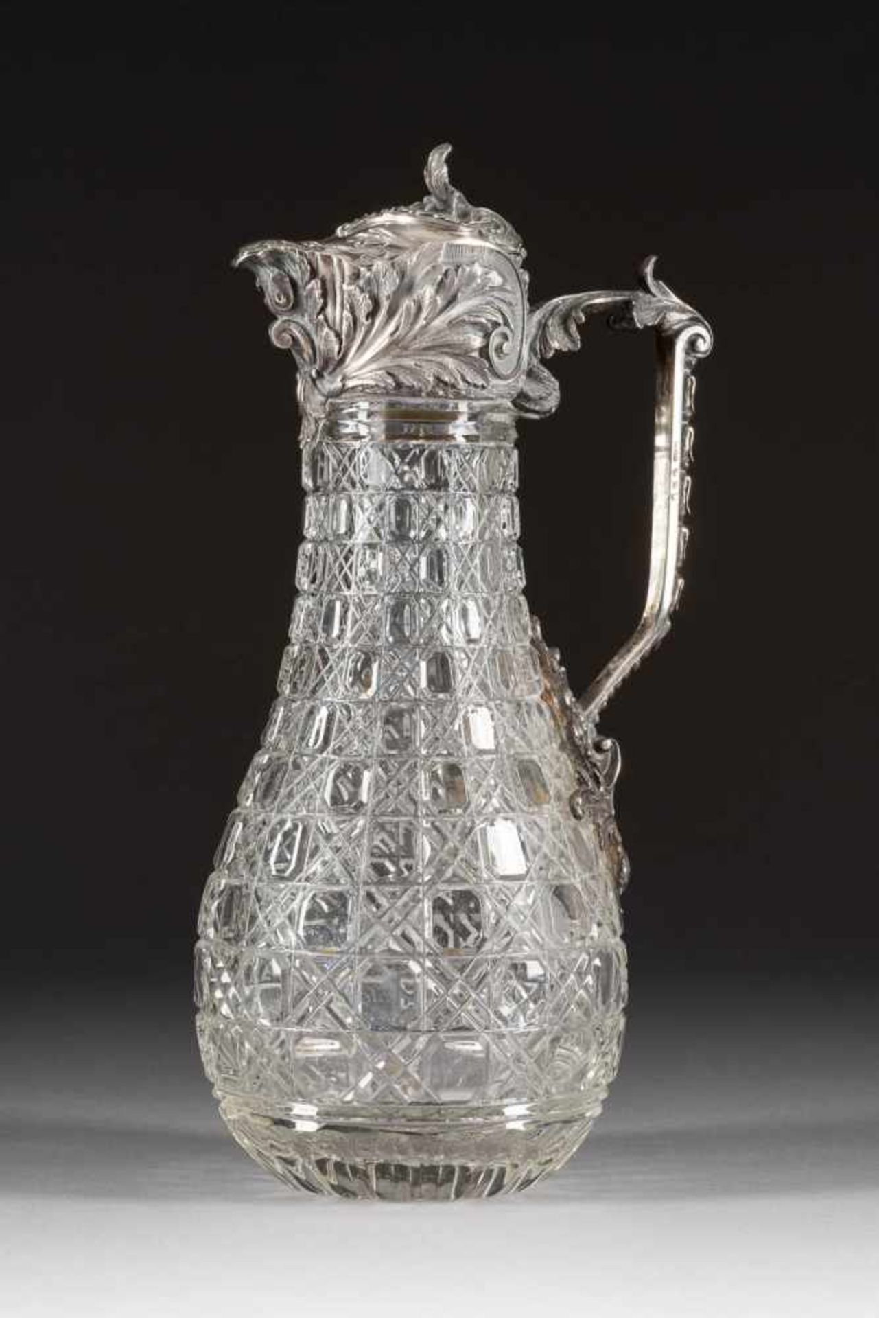 A SILVER-MOUNTED GLASS DECANTER