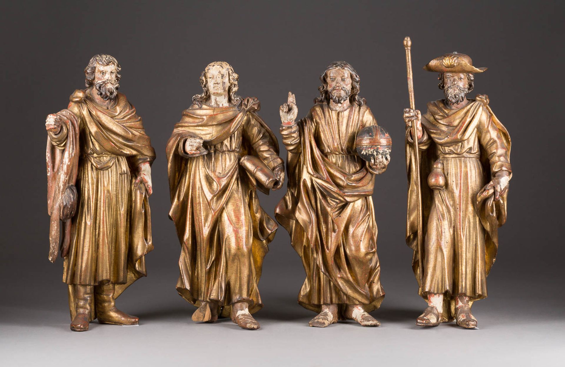 VIER HEILIGENFIGUREN Wohl Spanien, um 1700 Holz, plastisch geschnitzt, farbig gefasst und vergoldet,