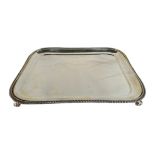 Sterling Silver Tray with four scroll legs and gadrooned rim, Edward Barnard & Sons. 736 grammes.