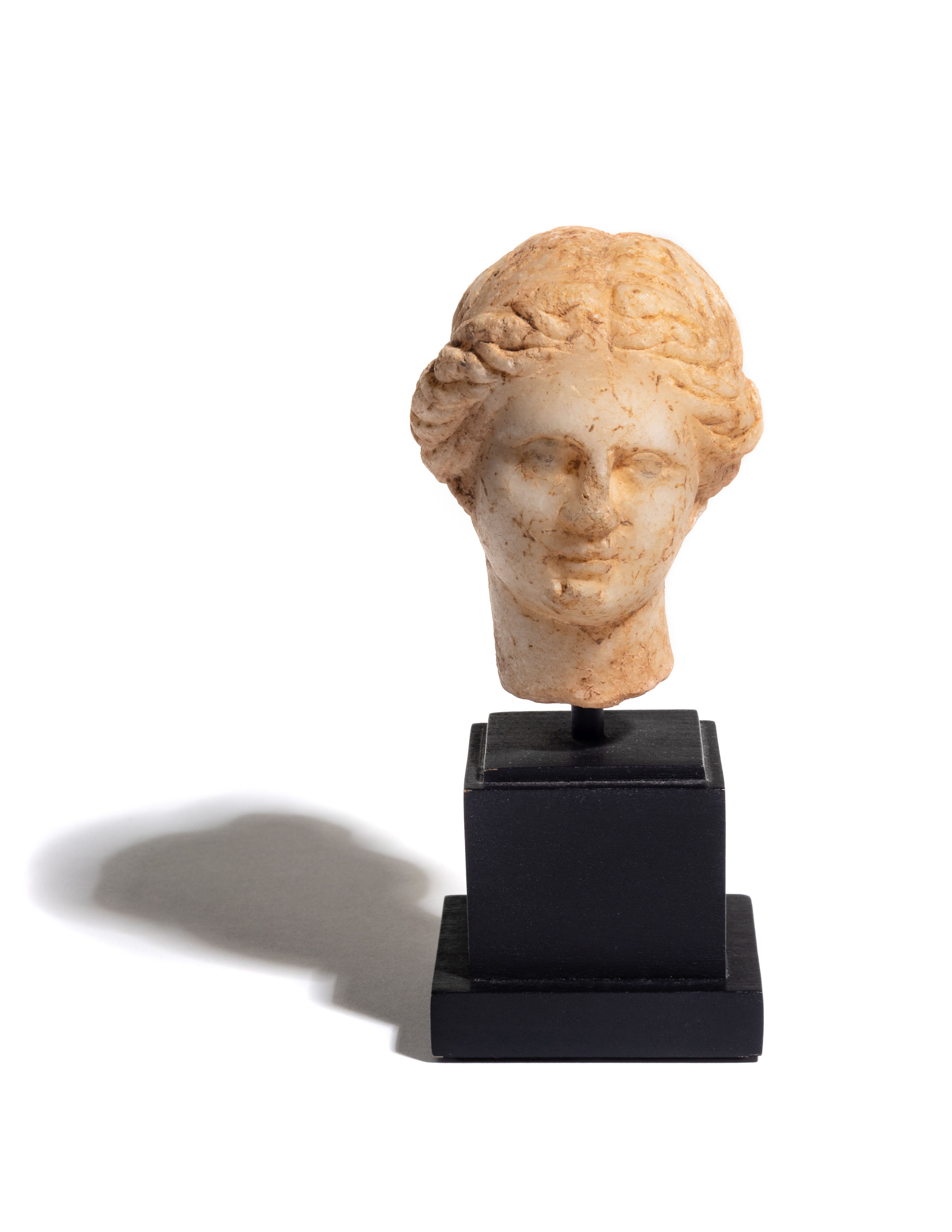 A Greek Marble Head of Aphrodite Height 3 1/2 inches.