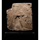 An Egyptian Limestone Sculptor's Model or Votive Relief