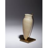 An Egyptian Alabaster Vessel Height 5 3/8 inches.