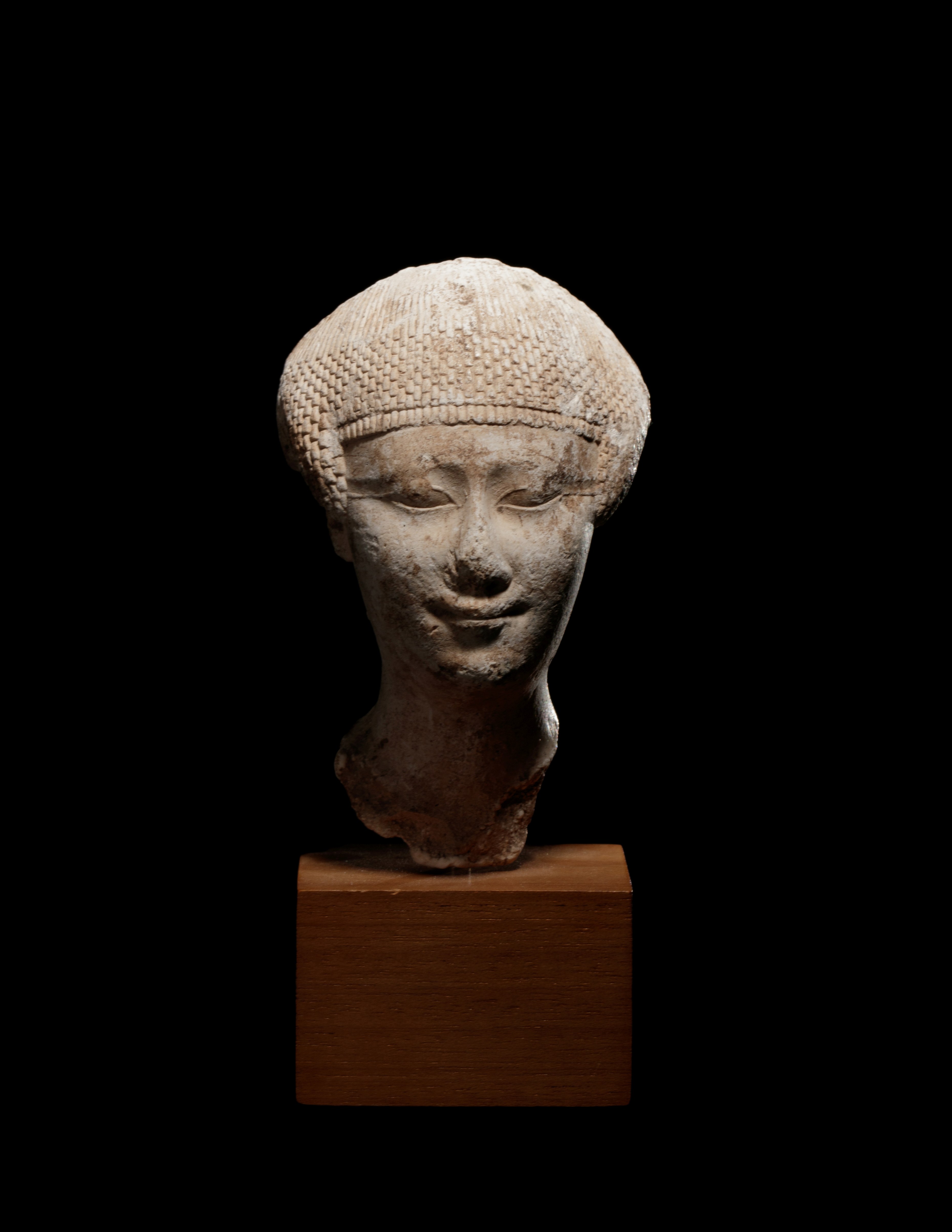 An Egyptian Limestone Head of a Noblewoman Height 4