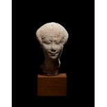 An Egyptian Limestone Head of a Noblewoman Height 4