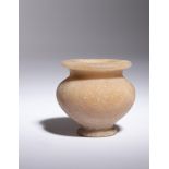 An Egyptian Alabaster Cosmetic Jar Height 2 1/8 inches.