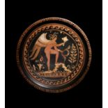 An Apulian Red-Figured Plate with Eros Diameter 9