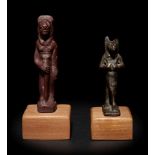 An Egyptian Stone Striding Bastet and an Egyptian