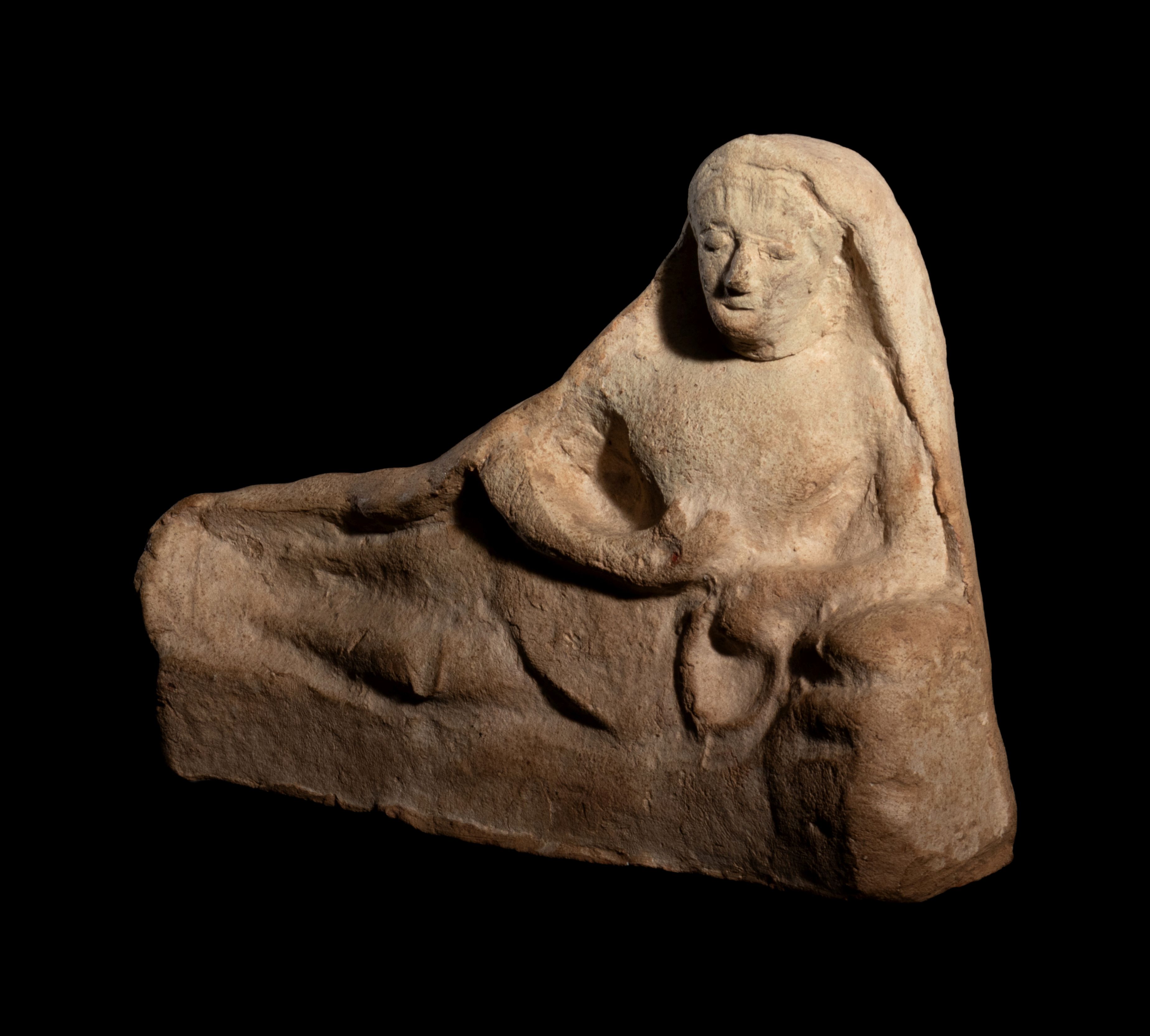 A Greek Terracotta Reclining Figure Height 5 1/2 x