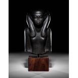 An Egyptian Basalt Portrait Bust of a Woman Height 10
