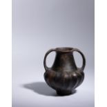 An Etruscan Bucchero Amphora Height 6 7/8 inches.