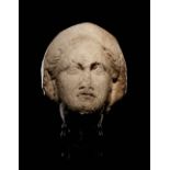 A Cypriot Limestone Head of a Goddess, Perhaps